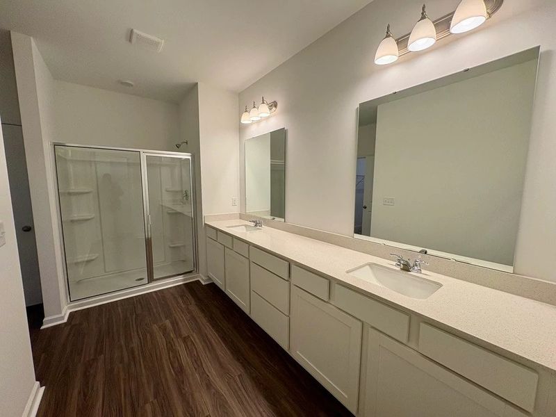 Primary Bath - Clean geometry and high-contrast finishes.