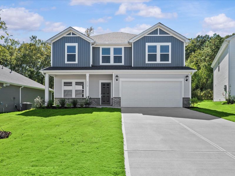 Front exterior of a new home in Vickery Station, Woodruff, SC, highlighting curb appeal (Image 1). Front exterior of a new home in Vickery Station, Woodruff, SC, highlighting curb appeal (Image 1).