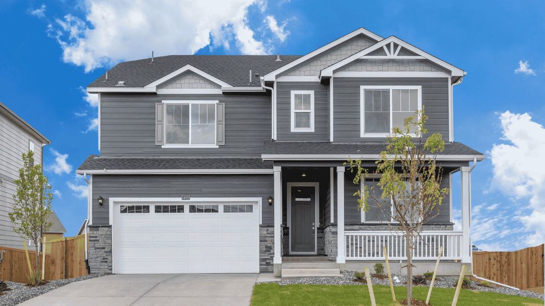 Front exterior of a new home in Trails at Crowfoot, Parker, CO, highlighting curb appeal (Image 1). Front exterior of a new home in Trails at Crowfoot, Parker, CO, highlighting curb appeal (Image 1).