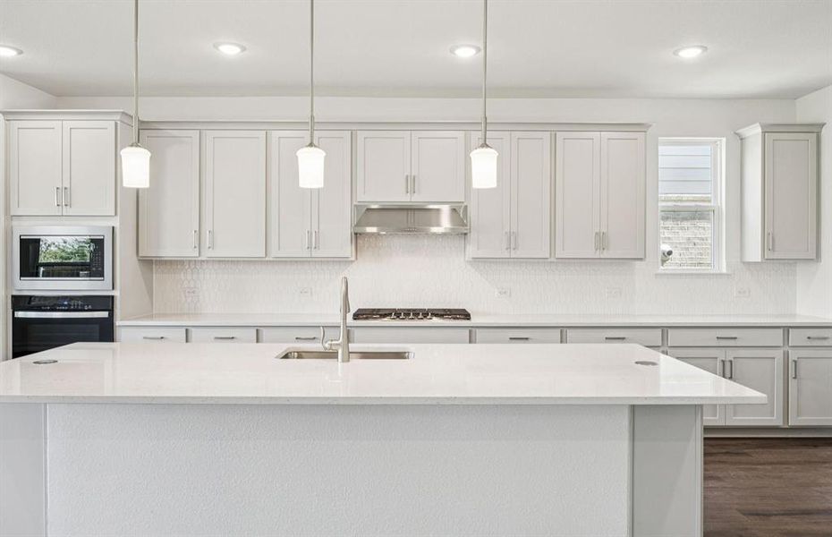 Spacious kitchen with eat-in bartop island Spacious kitchen with eat-in bartop island