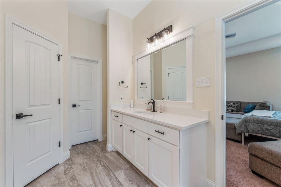 Bathroom featuring vanity and connected bathroom Bathroom featuring vanity and connected bathroom