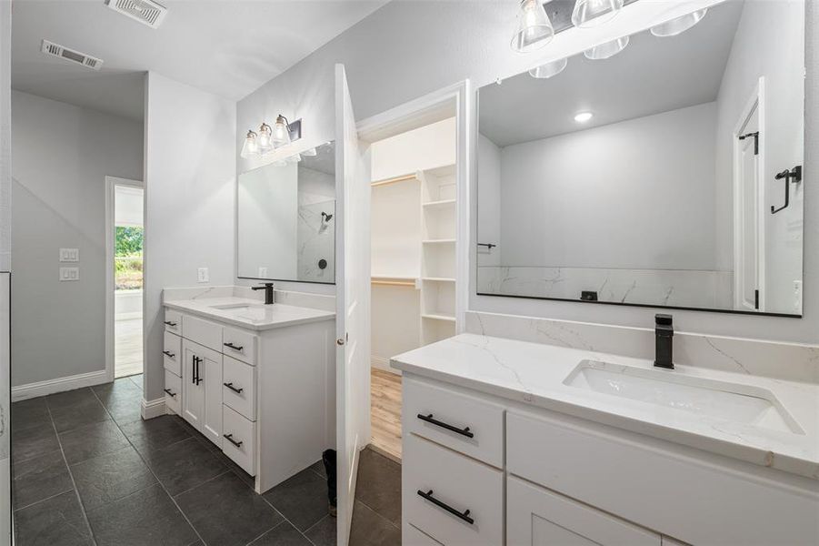 Full bath featuring vanity, tile patterned flooring, recessed lighting, and a shower Full bath featuring vanity, tile patterned flooring, recessed lighting, and a shower
