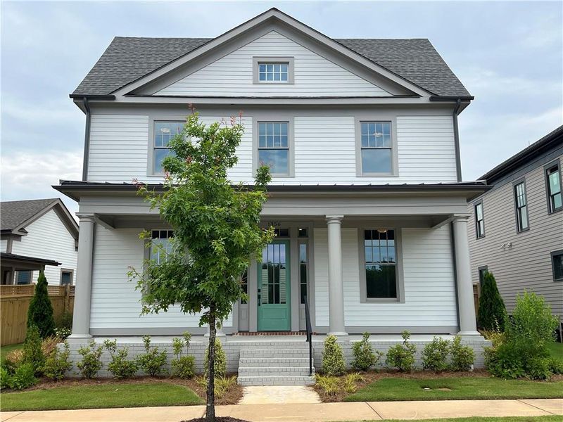 Front exterior of a new home in Eastmore, Conyers, GA, highlighting curb appeal (Image 25).