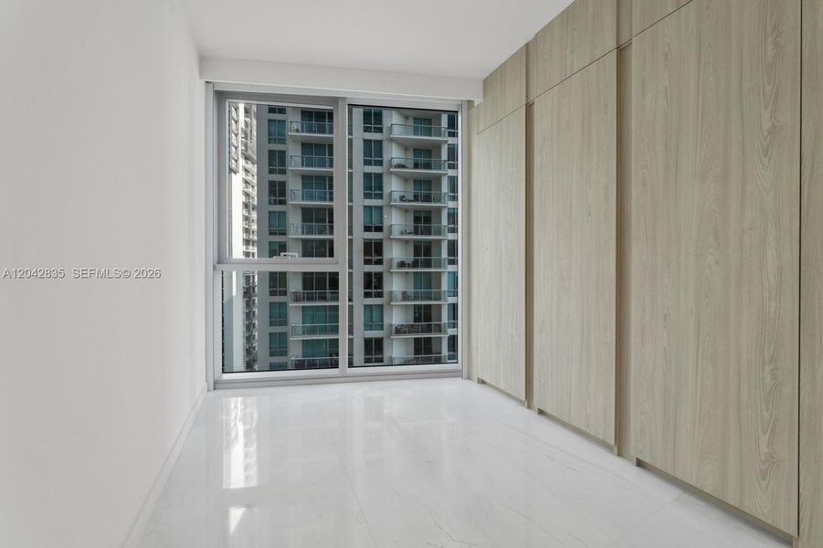 Spacious, unfurnished interior of a new home in Aston Martin Residences, Miami (Image 22).
