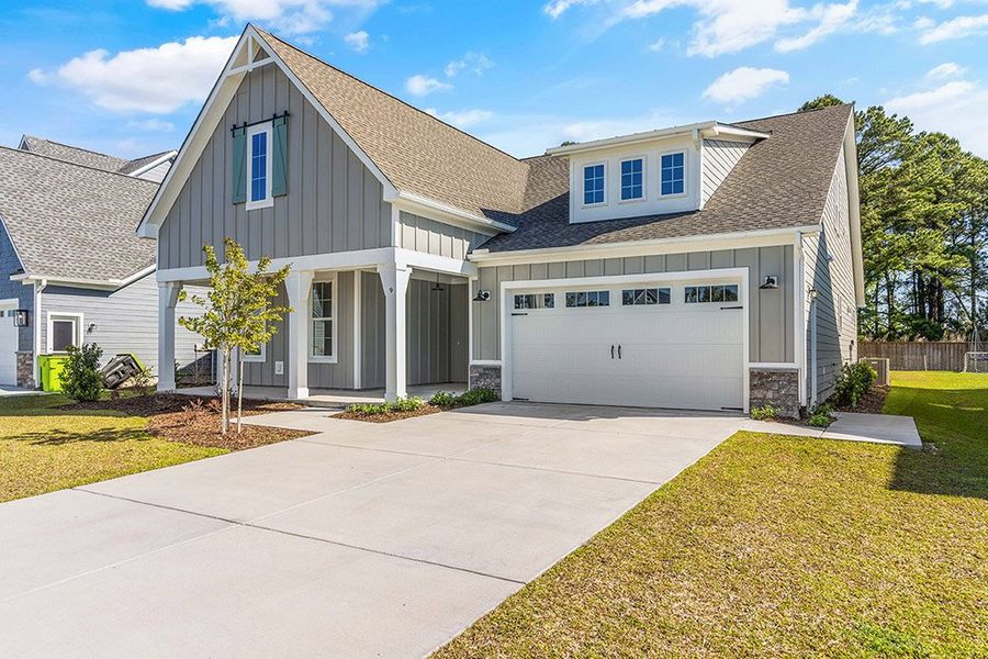 Representative exterior photo of a completed home built from the The Sutton by RobuckHomes in Windwater, Hampstead, NC (Image 10). Representative exterior photo of a completed home built from the The Sutton by RobuckHomes in Windwater, Hampstead, NC (Image 10).