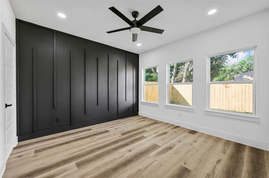 Spare room with light hardwood / wood-style floors and ceiling fan