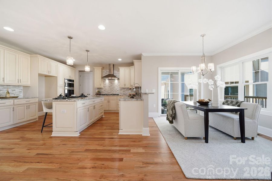 Expansive kitchen and breakfast area with seamless flow into the living room — perfect for gatherings. Expansive kitchen and breakfast area with seamless flow into the living room — perfect for gatherings.