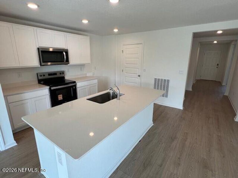 Furnished interior view inside a new home in Sawmill Branch, Palm Coast (Image 5).
