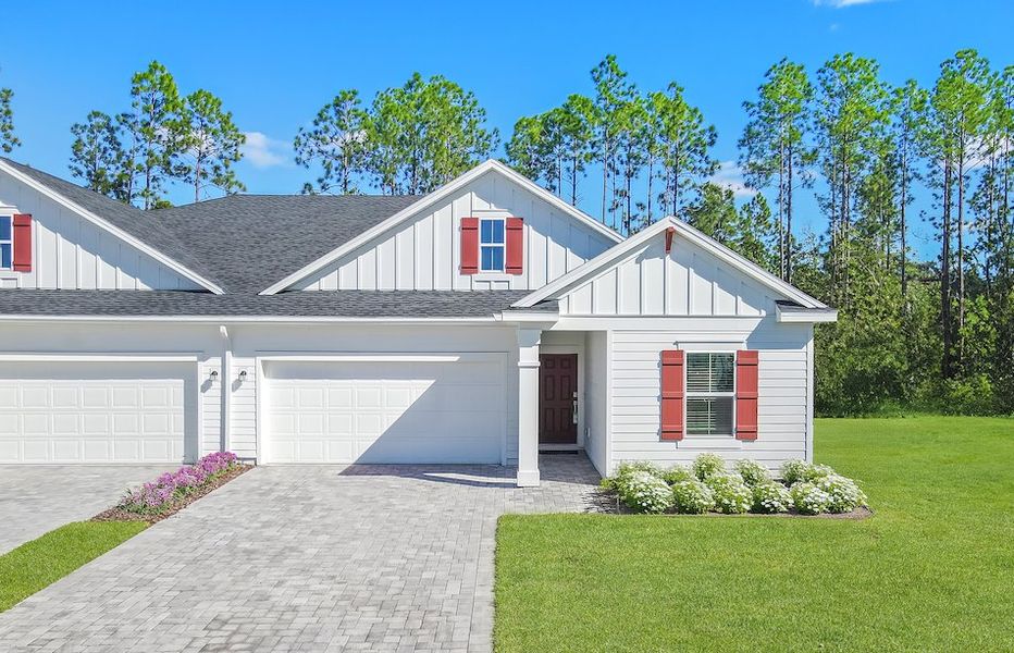 Front exterior of a new home in Silver Meadows at SilverLeaf: Silver Meadows Villas, St. Johns, FL, highlighting curb appeal (Image 1).