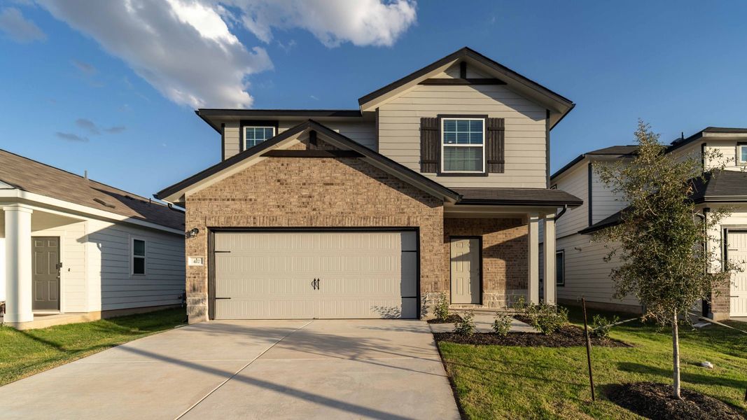 Front exterior of a new home in Sunset Oaks, Maxwell, TX, highlighting curb appeal (Image 1).