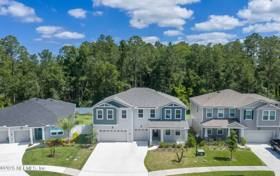 Front exterior of a new home in RiverTown - Settlement, St. Johns, FL, highlighting curb appeal (Image 2). Front exterior of a new home in RiverTown - Settlement, St. Johns, FL, highlighting curb appeal (Image 2).