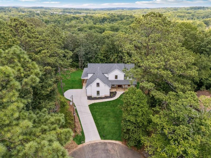 Front exterior of a new home in , Woodstock, GA, highlighting curb appeal (Image 24).