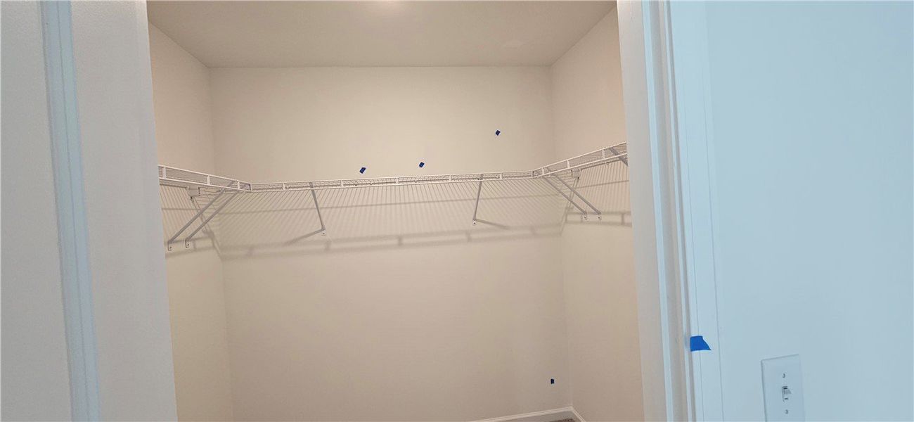 This spacious closet offers ample storage and orga