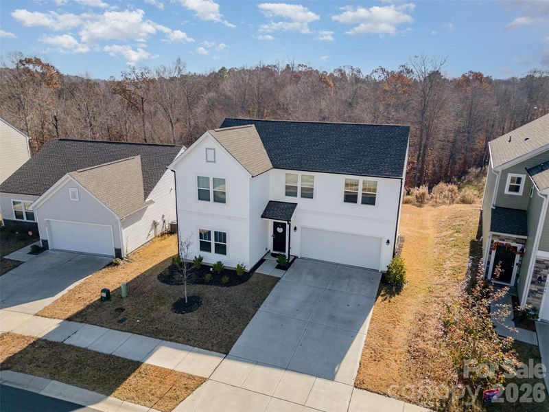 Front exterior of a new home in , Mount Holly, NC, highlighting curb appeal (Image 24).