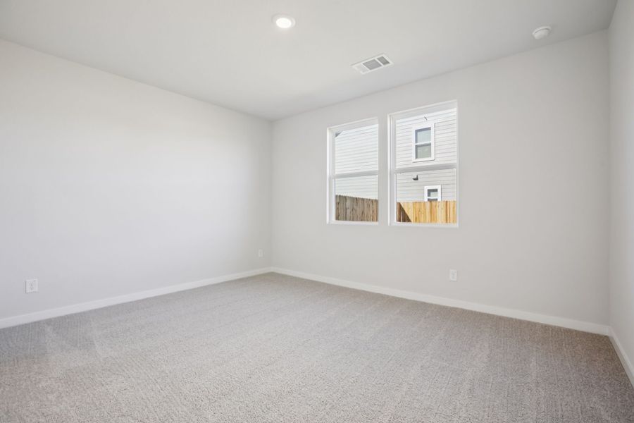 A room with a window and a door.