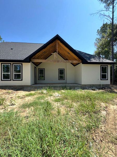 Front exterior of a new home in , Dayton, TX, highlighting curb appeal (Image 1).