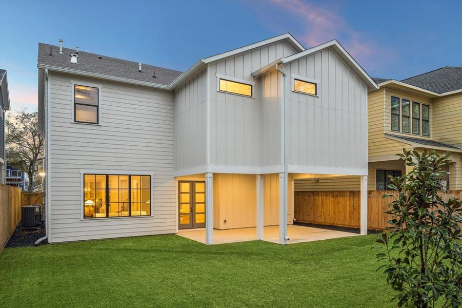 HUGE backyard with a covered porch. The home is also fitted with a sprinkler system and gutters.