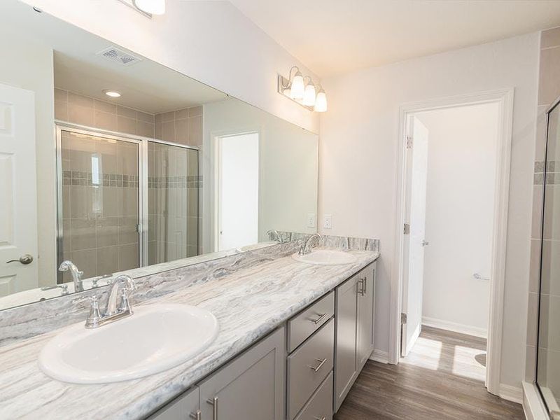 Your suite is complete with a walk-in wardrobe and dual-vanity en-suite bath - Blakely by Highland Homes