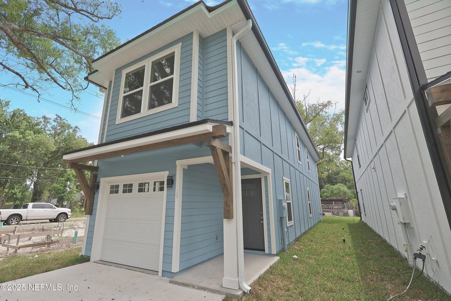 Front exterior of a new home in , Jacksonville, FL, highlighting curb appeal (Image 26). Front exterior of a new home in , Jacksonville, FL, highlighting curb appeal (Image 26).