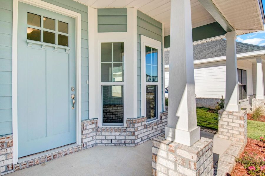 Front exterior of a new home in The Bluffs at Lafayette, Freeport, FL, highlighting curb appeal (Image 2). Front exterior of a new home in The Bluffs at Lafayette, Freeport, FL, highlighting curb appeal (Image 2).