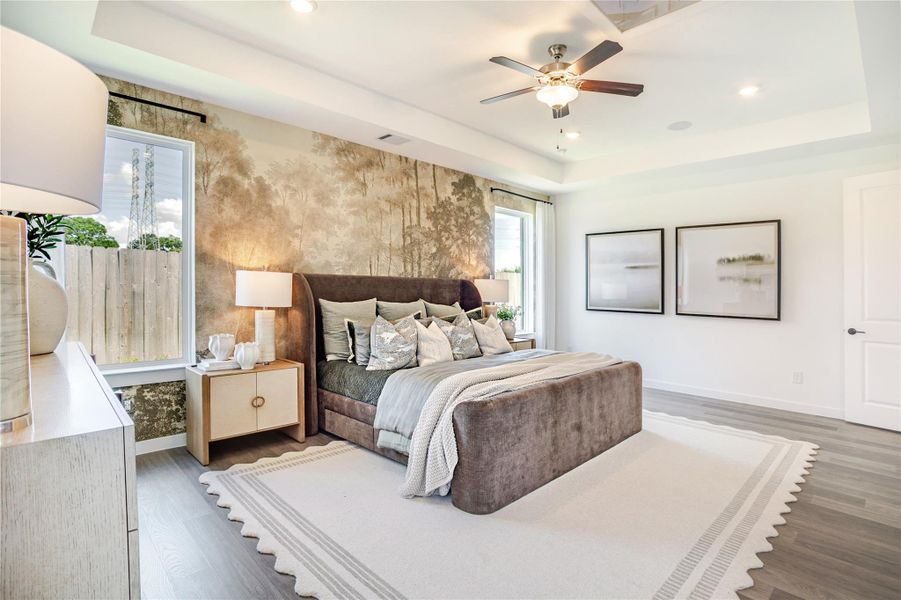 This spacious bedroom features a cozy bed with plush pillows, a stylish accent wall, and large windows that let in natural light. Modern fixtures and soft lighting create a warm, inviting atmosphere ideal for relaxation. This spacious bedroom features a cozy bed with plush pillows, a stylish accent wall, and large windows that let in natural light. Modern fixtures and soft lighting create a warm, inviting atmosphere ideal for relaxation.