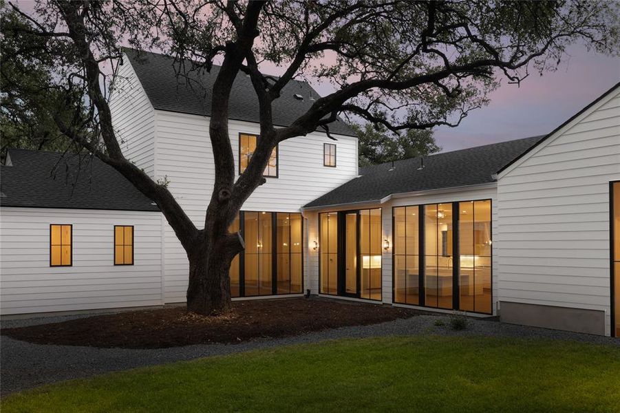 One of my favorite angles from the middle of the generous backyard, featuring and celebrating a classic Texas Heritage Live Oak tree. Come see the new deck built around it for extra outdoor living enjoyment.