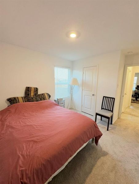 Bedroom featuring carpet floors