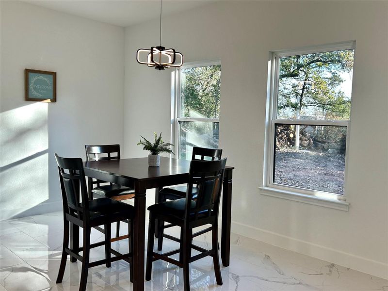 Dining area with view to the backyard.