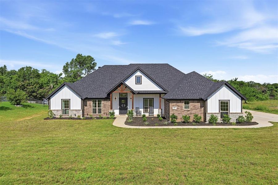 Front exterior of a new home in The Ranches at Valley View, Springtown, TX, highlighting curb appeal (Image 23).