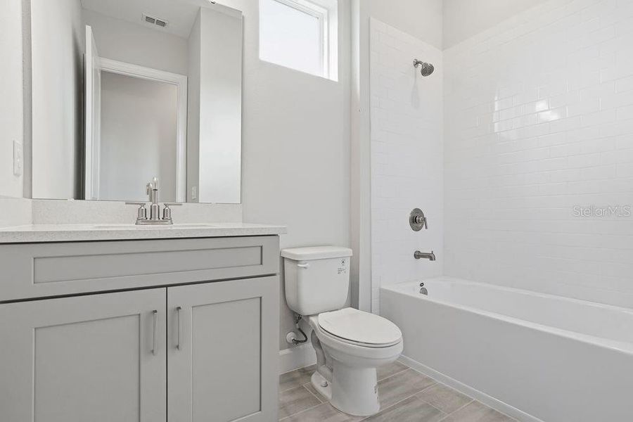 Furnished interior view inside a new home in Esplanade at Coasterra, Palmetto (Image 10).