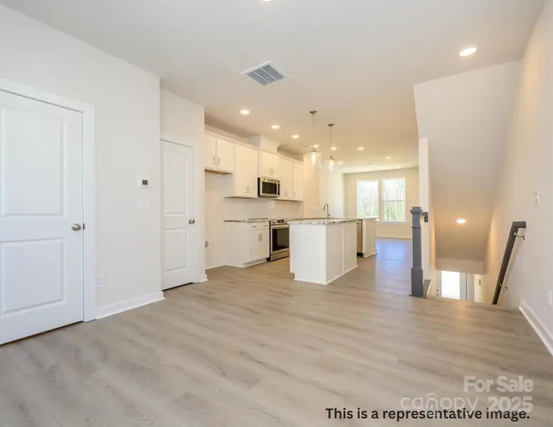 Spacious, unfurnished interior of a new home in Central Living at Craig, Charlotte (Image 5). Spacious, unfurnished interior of a new home in Central Living at Craig, Charlotte (Image 5).
