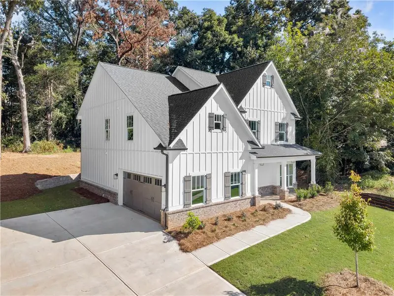 Front exterior of a new home in , Covington, GA, highlighting curb appeal (Image 2). Front exterior of a new home in , Covington, GA, highlighting curb appeal (Image 2).