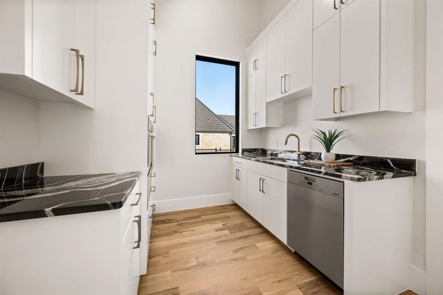 CATERING Kitchen featuring white cabinets, sink, dishwasher, oven, and light wood flooring