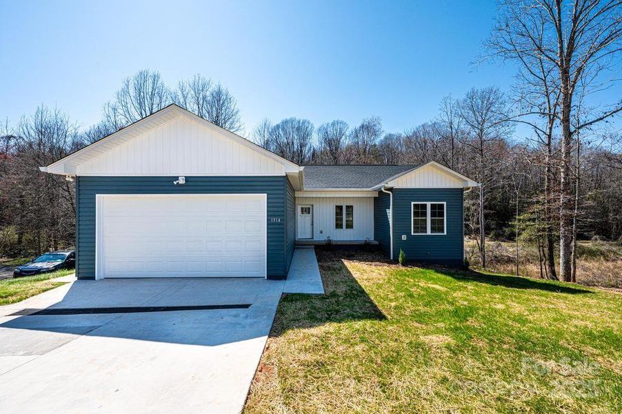 Front exterior of a new home in , Hickory, NC, highlighting curb appeal (Image 14).