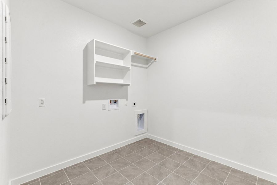 Utility Room in the Wimbledon home plan by Trophy Signature Homes – REPRESENTATIVE PHOTO Utility Room in the Wimbledon home plan by Trophy Signature Homes – REPRESENTATIVE PHOTO