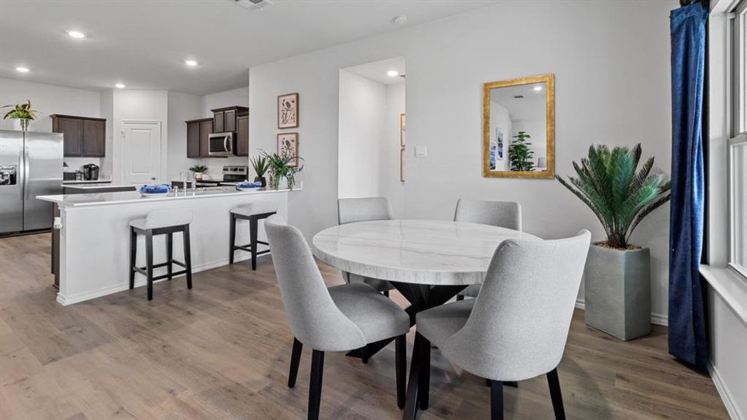 Dining area featuring light wood-style floors and recessed lighting Dining area featuring light wood-style floors and recessed lighting