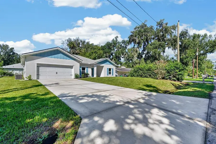 Front exterior of a new home in , New Smyrna Beach, FL, highlighting curb appeal (Image 21).