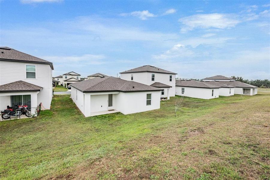 Exterior details and patio area of a home in Trilby Crossing, Brooksville (Image 20).