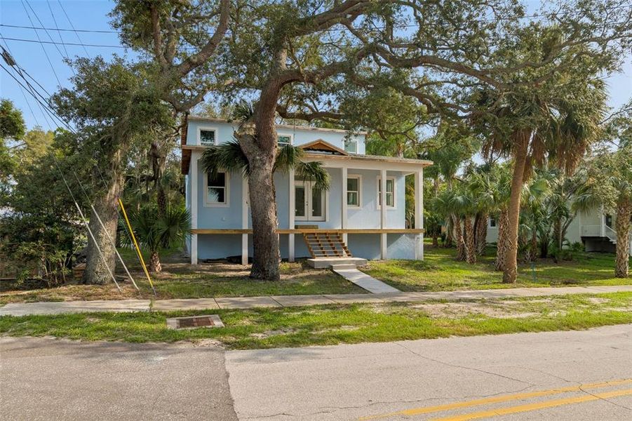 Front exterior of a new home in , Crystal Beach, FL, highlighting curb appeal (Image 10).