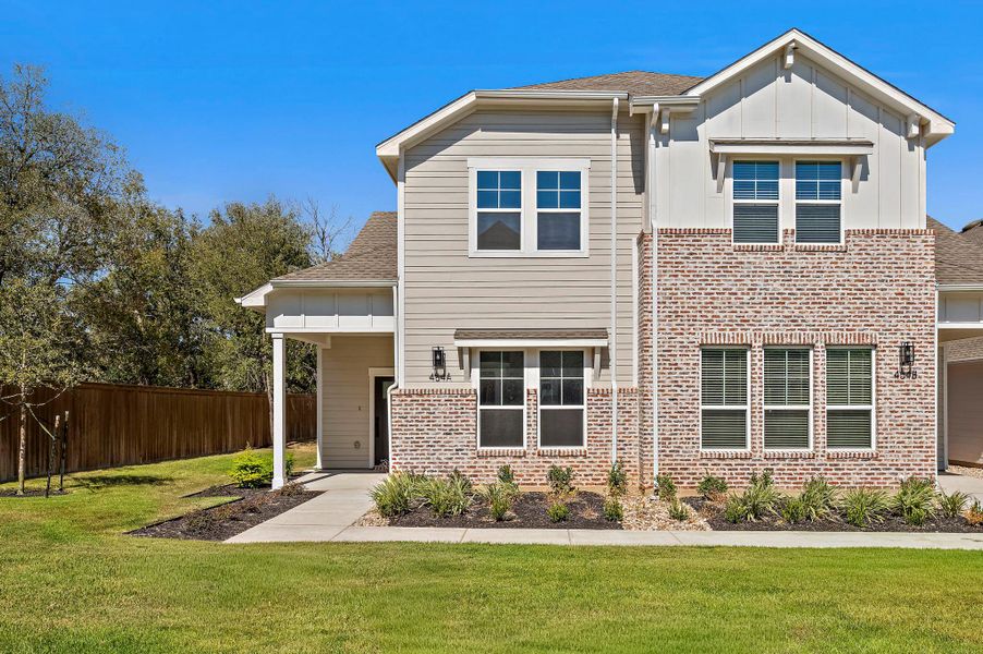 Front exterior of a new home in , Buda, TX, highlighting curb appeal (Image 19).