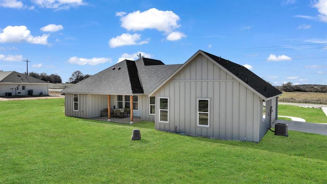 Exterior details and patio area of a home in Parallel Pastures, Poolville (Image 4).