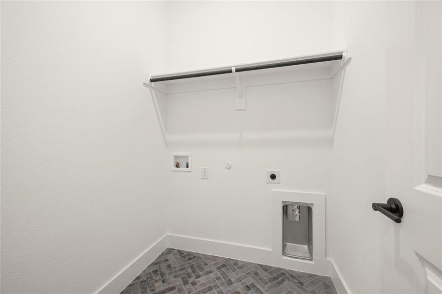 Laundry room featuring hookup for a gas dryer, hookup for a washing machine, and hookup for an electric dryer