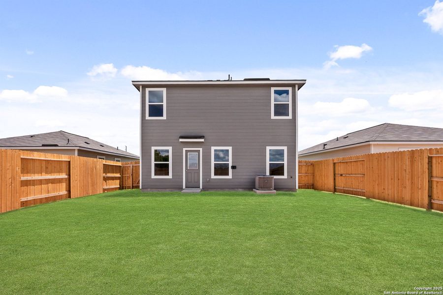 Front exterior of a new home in Blue Wing, San Antonio, TX, highlighting curb appeal (Image 13). Front exterior of a new home in Blue Wing, San Antonio, TX, highlighting curb appeal (Image 13).