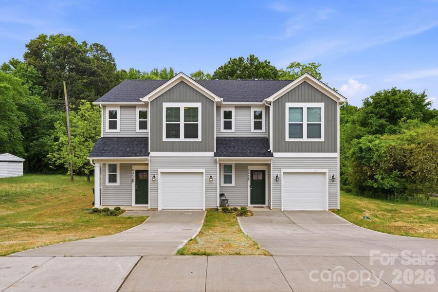 Front exterior of a new home in , Mooresville, NC, highlighting curb appeal (Image 19).