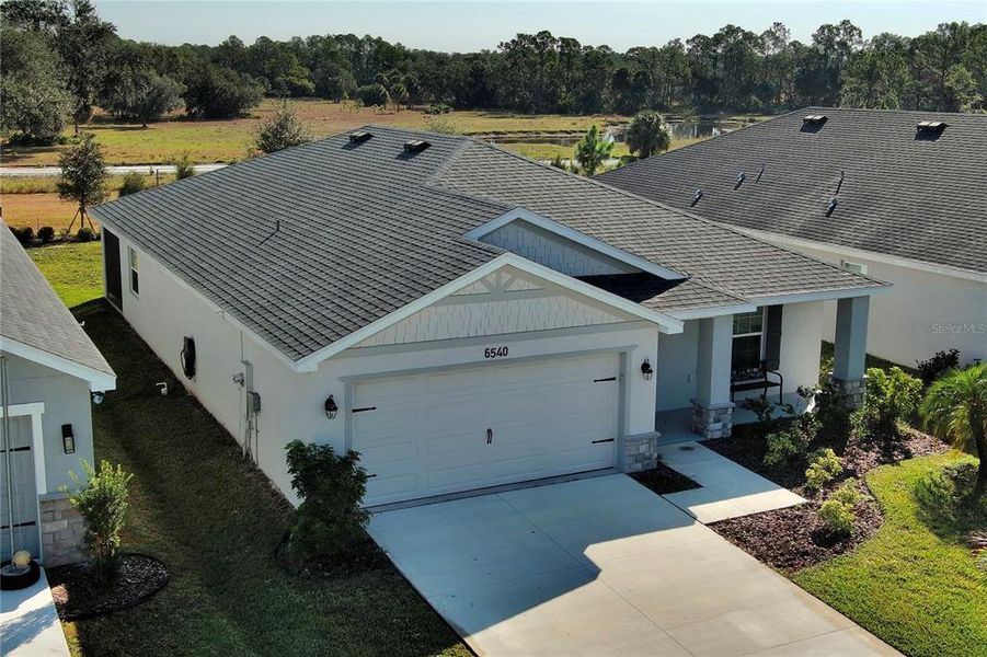 Front exterior of a new home in , Parrish, FL, highlighting curb appeal (Image 17).