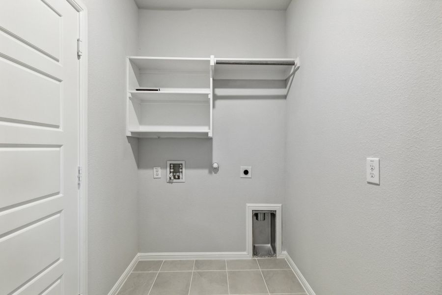 Utility room in the Sapphire home plan by Trophy Signature Homes – REPRESENTATIVE PHOTO Utility room in the Sapphire home plan by Trophy Signature Homes – REPRESENTATIVE PHOTO