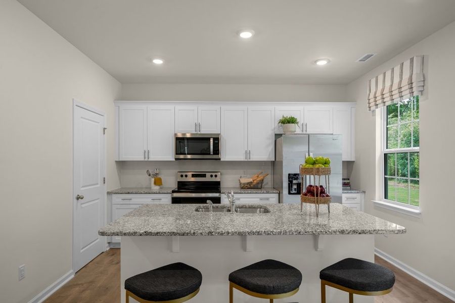 Representative furnished interior of a home built from the PENWELL by D.R. Horton in East Ridge, Ayden (Image 8).