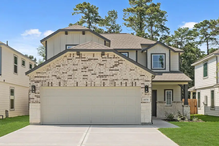 Front exterior of a new home in Cypresswood Landing, Humble, TX, highlighting curb appeal (Image 1). Front exterior of a new home in Cypresswood Landing, Humble, TX, highlighting curb appeal (Image 1).