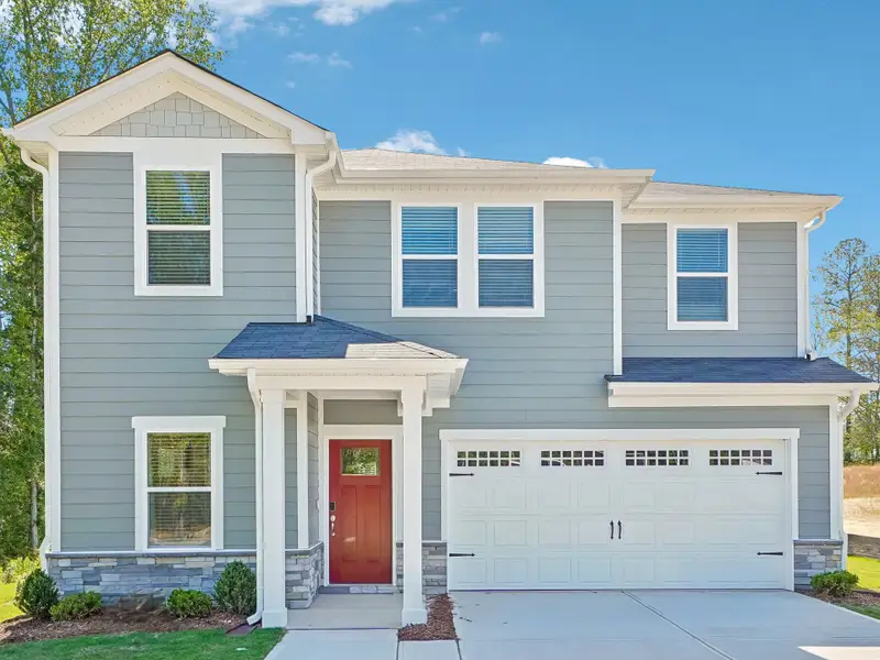 Front exterior of a new home in Cadence Meadows, Zebulon, NC, highlighting curb appeal (Image 1). Front exterior of a new home in Cadence Meadows, Zebulon, NC, highlighting curb appeal (Image 1).