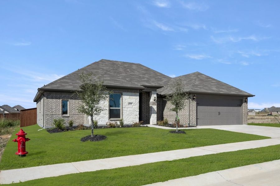 Front exterior of a new home in Still Water Lake, Godley, TX, highlighting curb appeal (Image 2). Front exterior of a new home in Still Water Lake, Godley, TX, highlighting curb appeal (Image 2).
